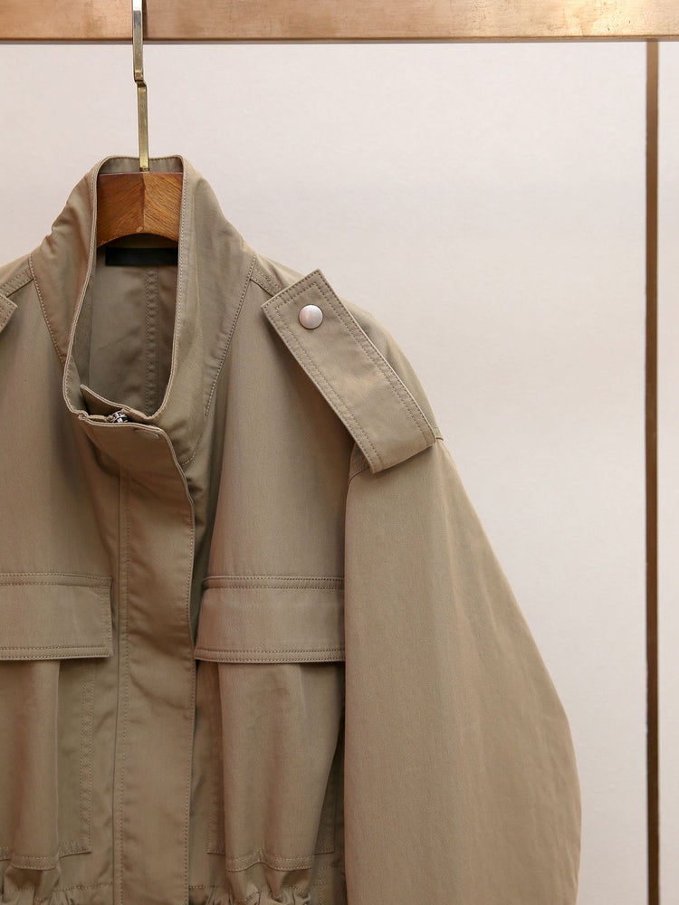 Shenzhen Nanyou high-end women's clothing autumn new French retro temperament workwear style stand-up collar drawstring trench coat for women